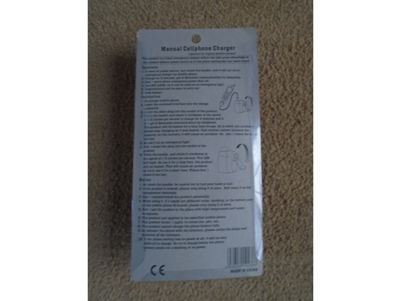 Manual cellphone (mobile) charger, brand new and in original packaging.