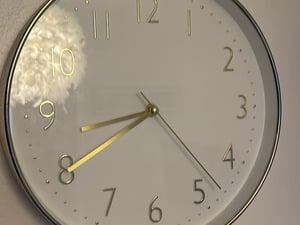 Gold and white clock  in Sandown