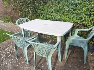 Green plastic garden table and 4 green plastic chairs in Sandown
