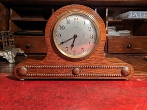 Small mechanical oak mantle/desk clock  in East Cowes
