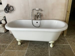 Freestanding roll top bath with chrome taps & shower in Newport