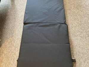Handy Black folding matress that can be used as a small chair in Bembridge