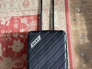 DKNY black carry on size suitcase  in Newport