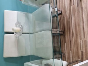 Glass table and 4 white chairs in Sandown