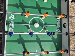 Wooden football table with 9 and side players on pitch measuring approx 20 x 35 inches in Ryde