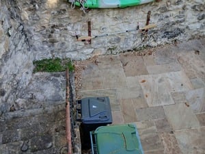 Twice-used fibreglass kayak with paddle and wall-mounted storage in Ventnor