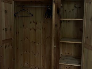 Triple wardrobe with top storage and drawers  in Ryde