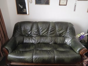 Green leather wood frame sofa,armchair and footstool  £120 in Newport